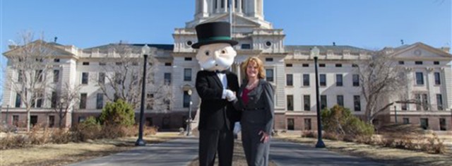 Mr. Monopoly, left, and Pierre Mayor Laurie Gill stand in front of the South Dakota State Capitol on March 13 in Pierre, S.D. Pierre will be the next “Boardwalk” in an upcoming version of Monopoly featuring U.S. cities. Associated Press