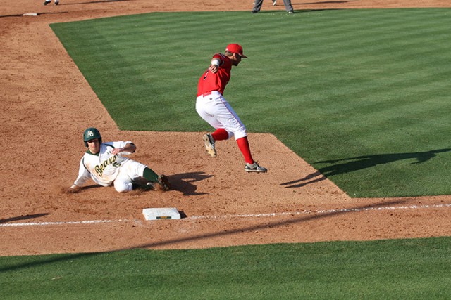 No. 16 senior outfielder Logan Brown slides past a Lamar baseman into third. Hannah Haseloff | Lariat Photographer