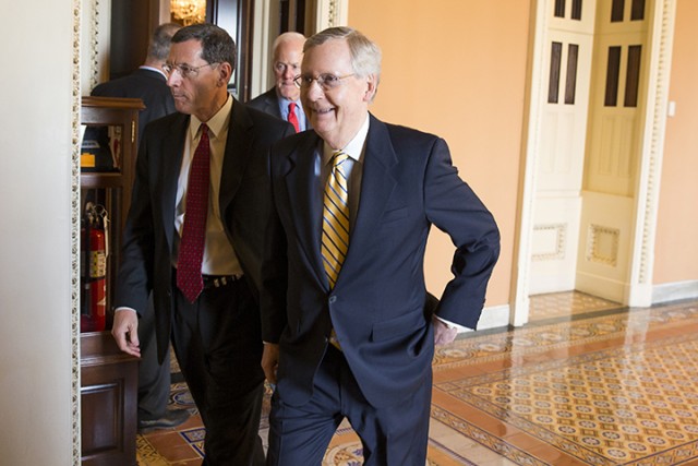 Senate Majority Leader Mitch McConnell, R- Ky., walks with Sen. John Barrasso, R-Wyo., and Senate Majority Whip John Cornyn of Texas, to a news conference Tuesday on Capitol Hill in Washington. Republican and Democratic lawmakers passed a human trafficking bill, and plan to turn their attention to Attorney General nominee Loretta Lynch.  Associated Press