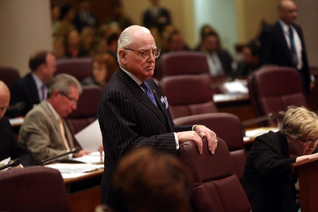 Chicago Alderman Edward Burke, 14th, stands at the start of city council meeting Wednesday, April 15, 2015, in Chicago. The Chicago City Council has approved a $5 million settlement with the family of a teenager who died after being shot by a police officer 16 times last October.  Associated Press
