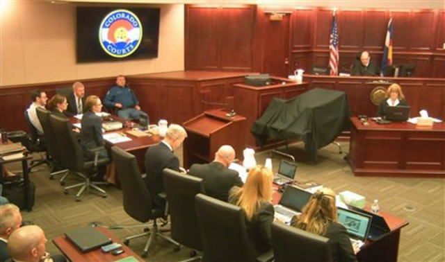 Judge Carlos A. Samour Jr., top right, presides over the opening of the trial of Colorado theater shooter James Holmes, far left, Monday in Centennial, Colo.  Associated Press