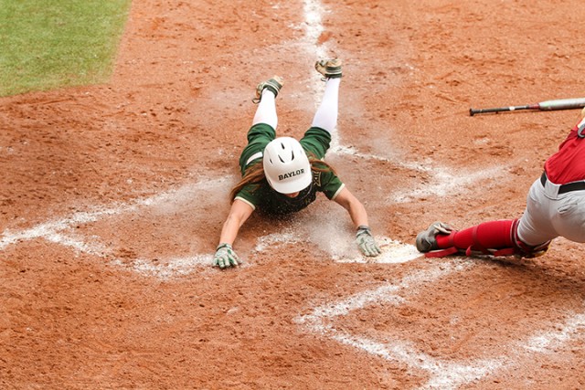 Sophomore outfielder Lindsey Cargill slides into home during Baylor’s series-clinching win over Iowa State on Sunday at Getterman Stadium.  Kevin Freeman | Lariat Photographer
