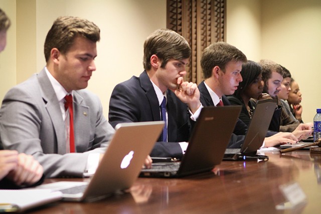 Members of Student Senate mull over their laptops Wednesday. Student Court held a hearing to discuss whether or not a bill passed by student government is constitutional. The bill deals members’ with access to the press.  Jess Schurz | Lariat Photographer