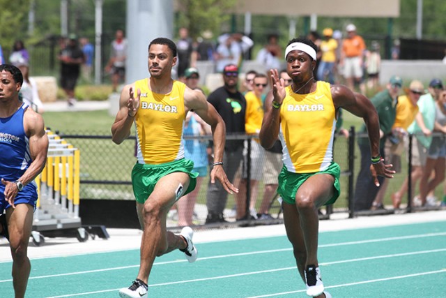 Juniors Bryce Grace and Felix Obi compete head to head in the 100-meter dash preliminary round. Teammate Trayvon Bromell won the event.   Hannah Haseloff | Lariat Photographer