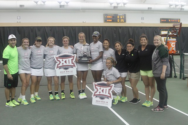 No. 8 Baylor women’s tennis celebrates together and holds up the Big 12 tournament championship trophy after a dominant 4-0 win over No. 16 Texas Tech at the Hawkins Indoor Tennis Facility on Sunday.  Hannah Haseloff | Lariat Photographer