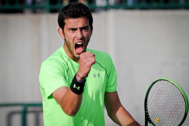 Tchoutakian celebrates a point during Baylor’s 4-3 loss to No. 1 Oklahoma on April 10.