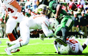 Baylor Quarterback Chris Johnson (13); Baylor's third-string quarterback was knocked out of the game in the first quarter after suffering a concussion. With a makeshift quarterback under center, BU would lose 23-17.