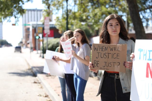 Protestors gather to speak against Anderson plea deal