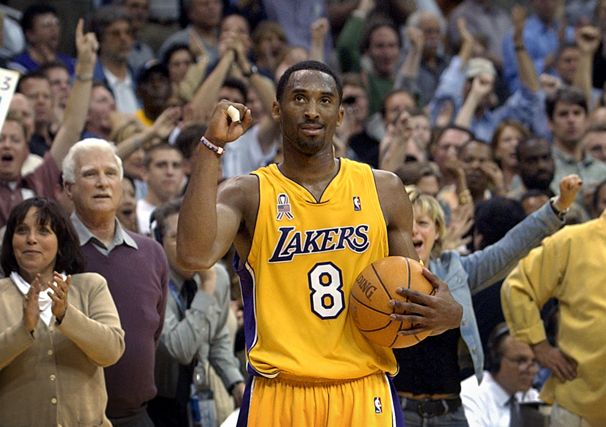 In this May 14, 2002 file photo Los Angeles Lakers guard Kobe Bryant watche...
