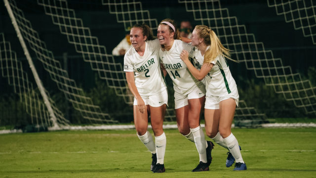 Freshman forward Mackenzie Anthony (middle) celebrates her first career goal with her teammates during the first half of Baylor's 2-0 win over No. 5 Kansas on Friday. Photo courtesy of Baylor Athletics