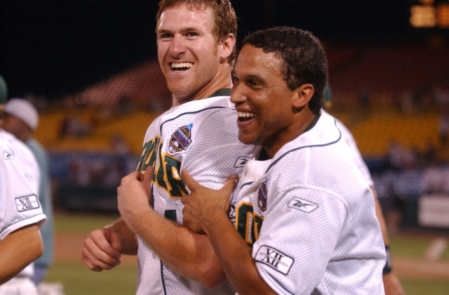 Baylor outfielder Reid Brees (left) celebrates with infielder Michael Griffin after scoring the tying run against Tulane. Photo by Duane A. Laverty | Courtesy of the Waco Tribune-Herald