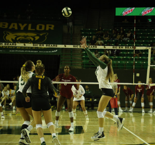 Hannah Sedwick sets up a kill for Shelly Stafford during a 2019 match against Oklahoma at the Ferrell Center. Lariat File Photo