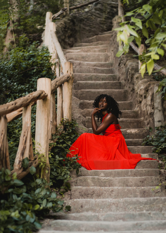 Grapevine senior Candy Okwena poses in a vibrant dress on Jacob's Ladder in Cameron Park. Photo courtesy of Kaitlyn Clink.