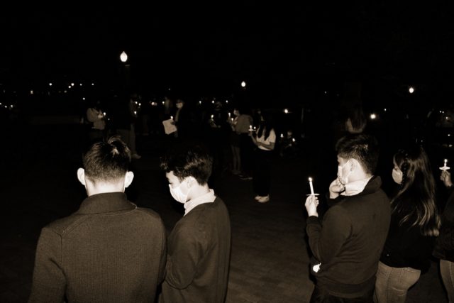 Attendees of Friday night's vigil concluded with a candle lighting ceremony to honor