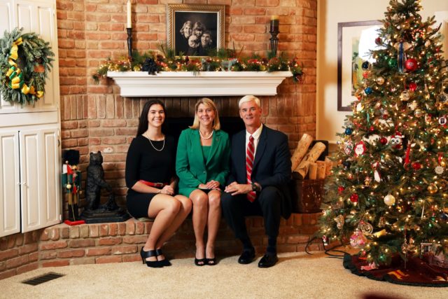The First Family sits in front of their fireplace during the 2018 Christmas season. Photo courtesy of Baylor Photography.