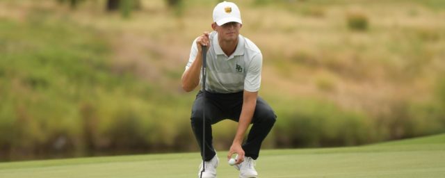 Junior Luke Dossey places his ball on the green at the Fighting Illini Invitational. Photo courtesy of Baylor Athletics