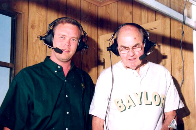 John Morris (left) with his broadcast partner Frank Fallon on the job. The pair worked together from 1987 to 1995.
Photo courtesy of Baylor Photography