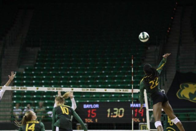 Senior outside hitter Yossiana Pressley rises up for a kill against the University of Kansas on Oct. 15 at the Ferrell Center.
Brittany Tankersley | Photographer