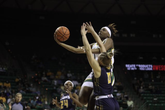 Senior forward NaLyssa Smith drives to the rim against Texas A&M-Commerce on Oct. 27 in the Ferrell Center.
Brittany Tankersley | Photographer