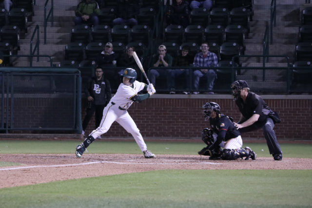 Junior infielder Jack Pineda takes a swing against the University of Maryland on Feb. 18 at Baylor Ballpark. Pineda tried to spark the Bears late with a one-out double in the bottom of the eighth, but was unsuccessful. Grace Everett | Photographer