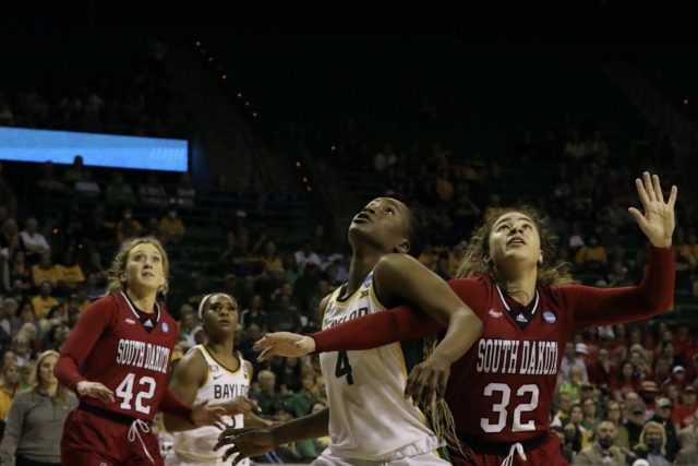 Queen Egbo keeps her eyes on the ball on March 20 at the Ferrell Center.Grace Everett | Photographer