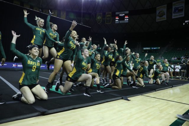 No.1 Baylor A&T celebrate their win over No. 3 Oregon on Feb. 27 in the Ferrell Center with a Sic'em. Grace Everett | Photographer