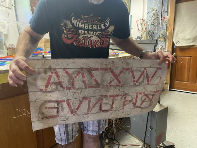 This is Livingston&squot;s outline for creating glass letters. When he practiced with this tarp at his internship he said "I was so bad at it, I had no precision."