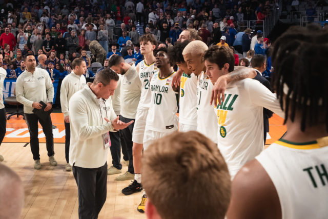 Members of the Baylor basketball team huddle together after falling short in their historic comeback attempt against the University of North Carolina on March 19 in Forth Worth at the Dickies Arena. Josh Wilson | RoundUp