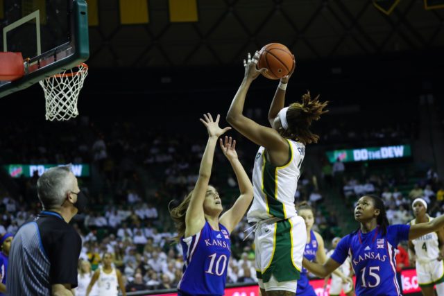 Senior forward NaLyssa Smith goes up for a jump shot against Kansas, contributing a career-high 33 points and 16 rebounds for the win on Feb. 26 in the Ferrell Center.
Brittany Tankersley | Photo Editor