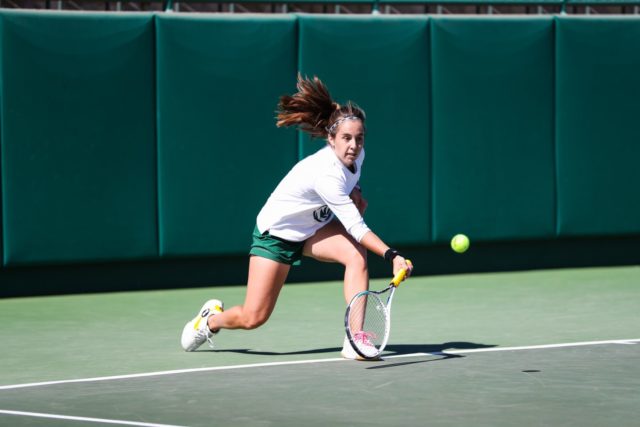 Junior Paula Barañano makes a break for the ball April. 8 against Kansas State at the Hurd Tennis Center. Brittany Tankersley | Photo Editor