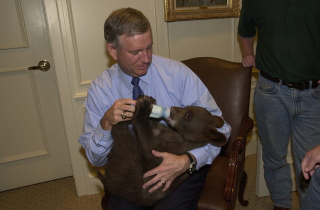 In June 2001, Baylor 12thPresident Robert B. Sloan Jr. welcomed four-month-old Joy to the President’s Office in Pat Neff Hall with three bottles of formula, which Joy drained in a matter of minutes. Photo courtesy of Cliff Cheney | Baylor University