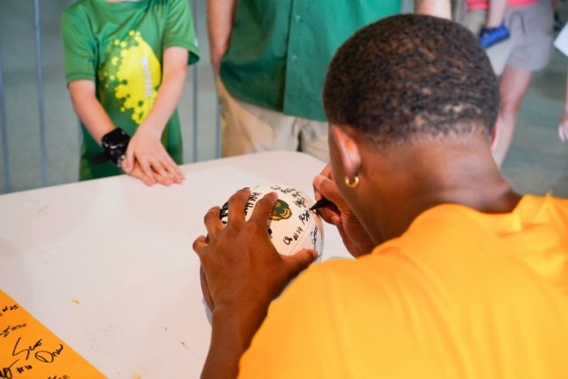 Baylor fan getting a football signed at Meet the Bears on Saturday, August 27.Assoah Ndomo | Photographer