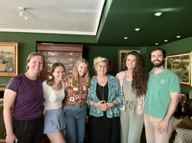 Ella Whatley (white t-shirt) pictured with her host family and fellow Baylor students.