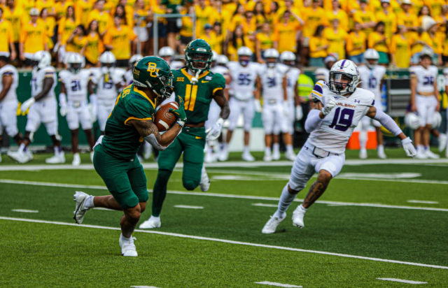 Gavin Holmes in the midst of running his 72-yard punt return from the UAlbany game. Kenneth Prabhakar | Photographer