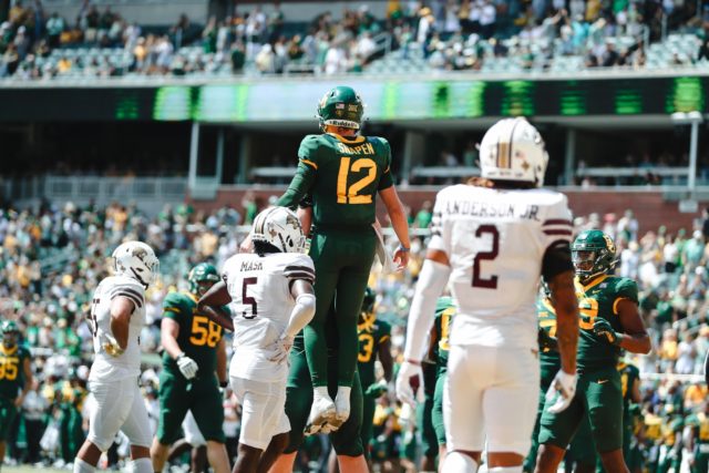 A Baylor offensive lineman lifts up sophomore quarterback Blake Shapen following an explosive play against Texas State University on Sept. 17, 2022 at McLane Stadium. Assoah Ndomo | Photographer