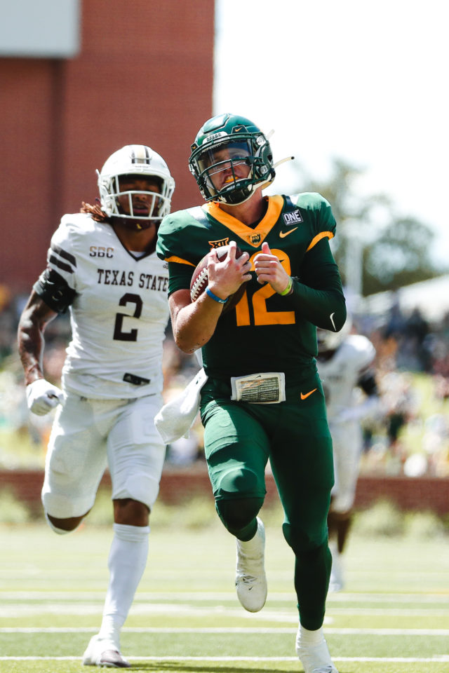 Sophomore quarterback crosses the goal line after a 35-yard touchdown rush with 26 seconds left in the first half against Texas State University on Sept. 17, 2022 at McLane Stadium. Assoah Ndomo | Photographer