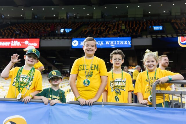 Several kids pose in their "Geaux Gold" gear at the 2022 Sugar Bowl on Jan. 1, 2022. Josh Wilson | Roundup