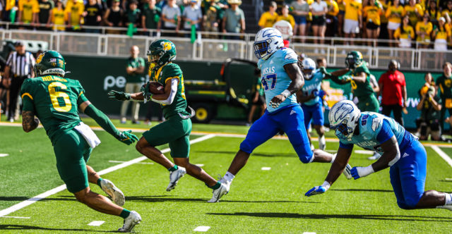 Freshman running back Richard Reese zips up the middle during a conference game against the University of Kansas on Oct. 22, 2022 at McLane Stadium.Kenneth Prabhakar | Photographer