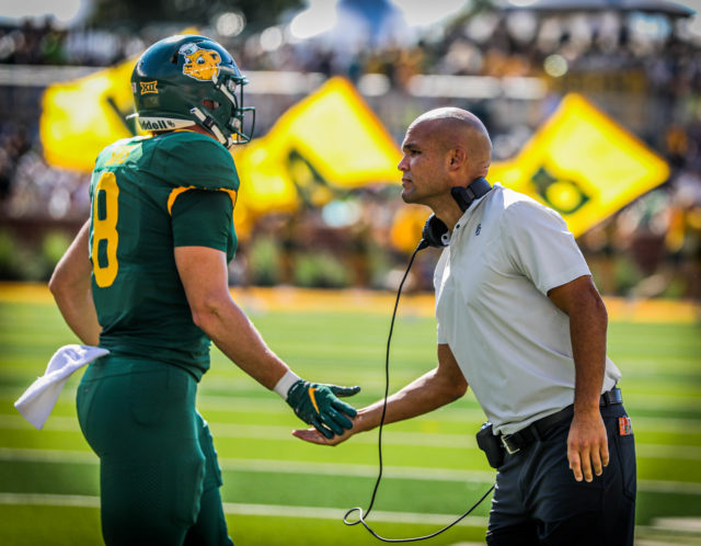 Head coach Dave Aranda shows love to fifth-year senior tight end Ben Sims during a conference game against the University of Kansas on Oct. 22, 2022 at McLane Stadium.Kenneth Prabhakar | Photographer