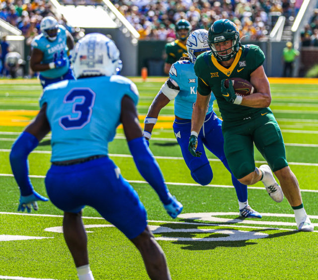 Fifth-year senior tight end Ben Sims trudges his way forward after catching a pass during a conference game versus the University of Kansas on Oct. 22, 2022 at McLane Stadium.
Kenneth Prabhakar | Photographer