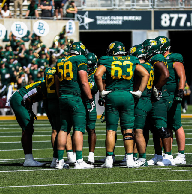The Baylor football team huddles up before an offensive play during a conference game against the University of Kansas on Oct. 22, 2022 at McLane Stadium.
Kenneth Prabhakar | Photographer