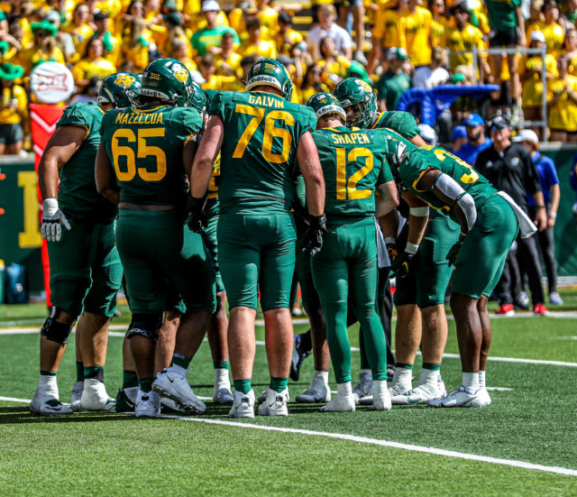The Baylor football team huddles before an offensive play during a conference game against the University of Kansas on Oct. 22, 2022 at McLane Stadium.
Kenneth Prabhakar | Photographer