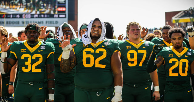 The Baylor football team takes part in "That Good Old Baylor Line" after winning a conference game against the University of Kansas 35-23 on Oct. 22, 2022 at McLane Stadium. 
Kenneth Prabhakar | Photographer