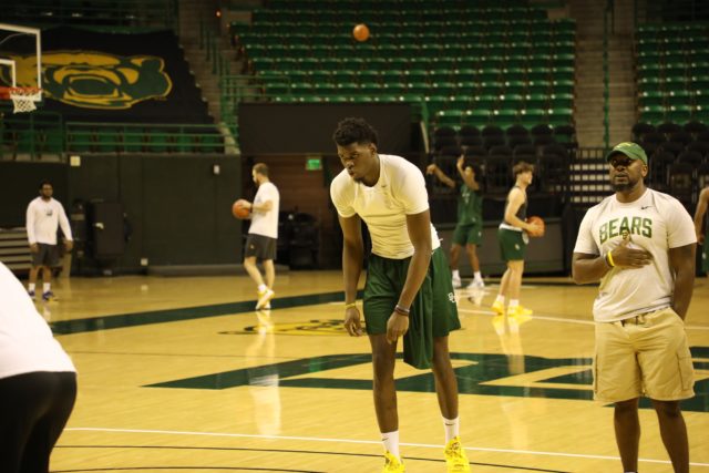 Freshman forward Josh Ojianwuna gets in a stance before progressing through a team practice drill on Sept. 27 at the Ferrell Center. Assoah Ndomo | Photograper
