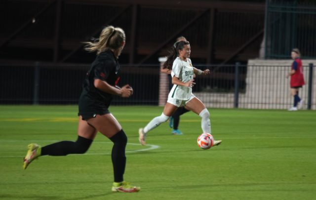 Junior midfielder pushes the attack up the middle of the field during a conference match against Oklahoma State University on Oct. 27, 2022 at Betty Lou Mays Field. 
Olivia Havre | Photographer