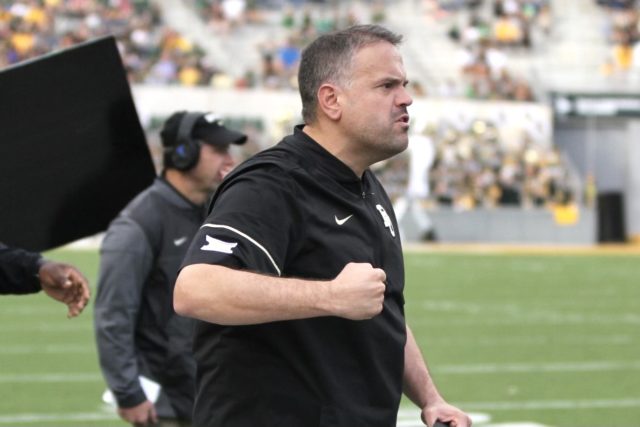 Former Baylor head coach Matt Rhule (2017-2019) gets fired up on the sidelines at McLane Stadium. Lariat File Photo