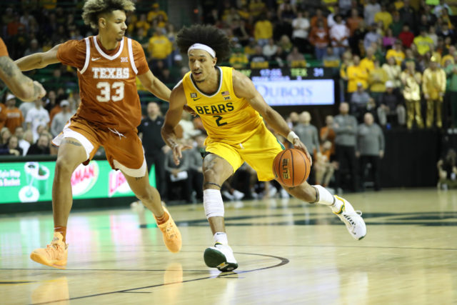 Former Baylor forward Kendall Brown drives past a Longhorn defender in a conference game against the University of Texas on Feb. 12, 2022 in the Ferrell Center.
Lariat file photo