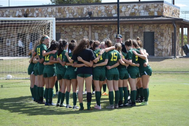 The Baylor women's club soccer team huddles up together. 
Photo courtesy of Dennis Trammell