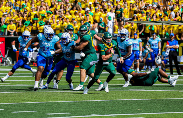 Sophomore quarterback Blake Shapen escapes the pocket and scrambles for a gain during a conference game against the University of Kansas on Oct. 22, 2022 at McLane Stadium.
Kenneth Prabhakar | Photographer