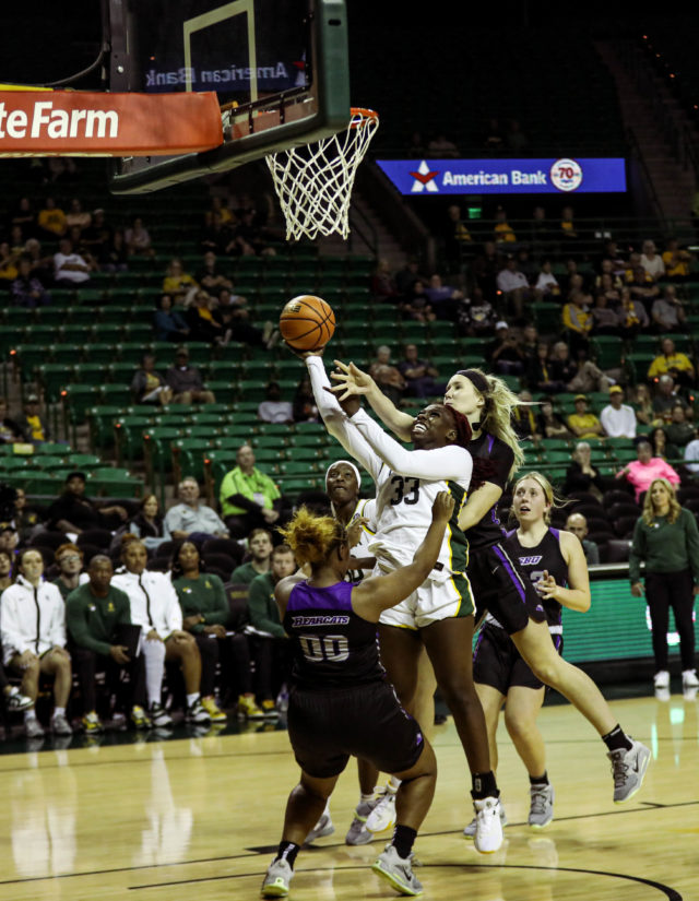 Senior guard Aijha Blackwell fights through contact on a layup attempt during an exhibition game against Southwest Baptist University on Nov. 3, 2022 in the Ferrell Center.
Kenneth Prabhakar | Photographer